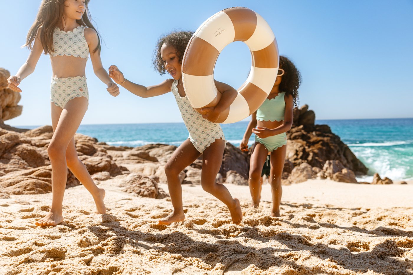 kids on the beach in cabo